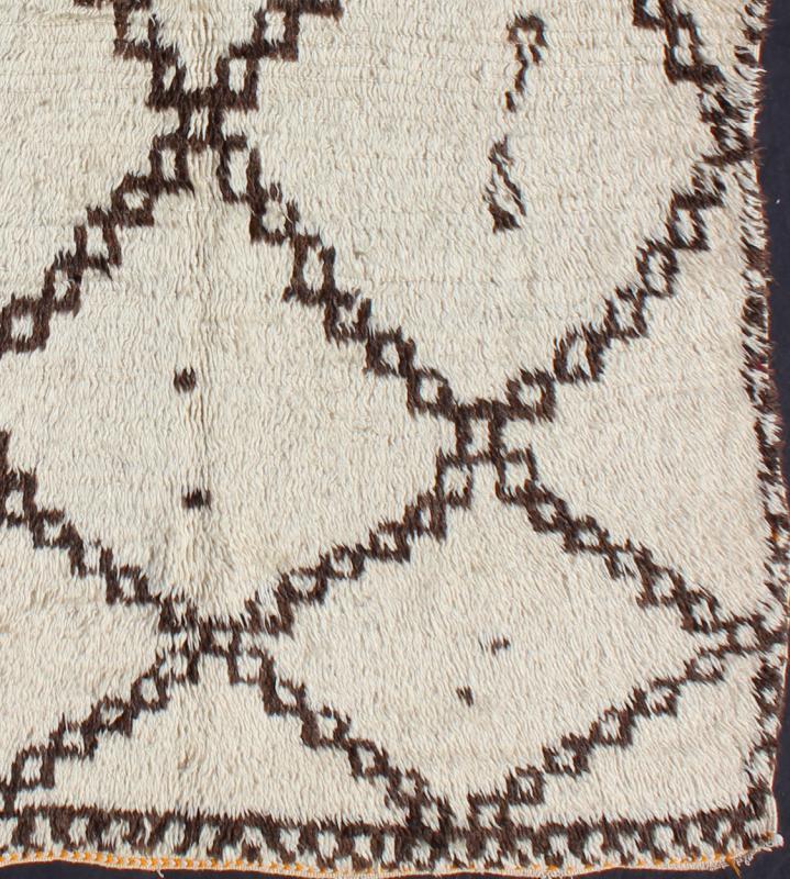 White Background Mid - Century Moroccan Azilal Rug with Brown Diamond Design Measures: 4'10'' x 7'0''. This graphic handwoven, tribal Beni Ourain rug features an all - over design of large, interconnected diamond shapes, some of which host tribal... - Keivan Woven ArtsBDS - 136623 - 7283Rug