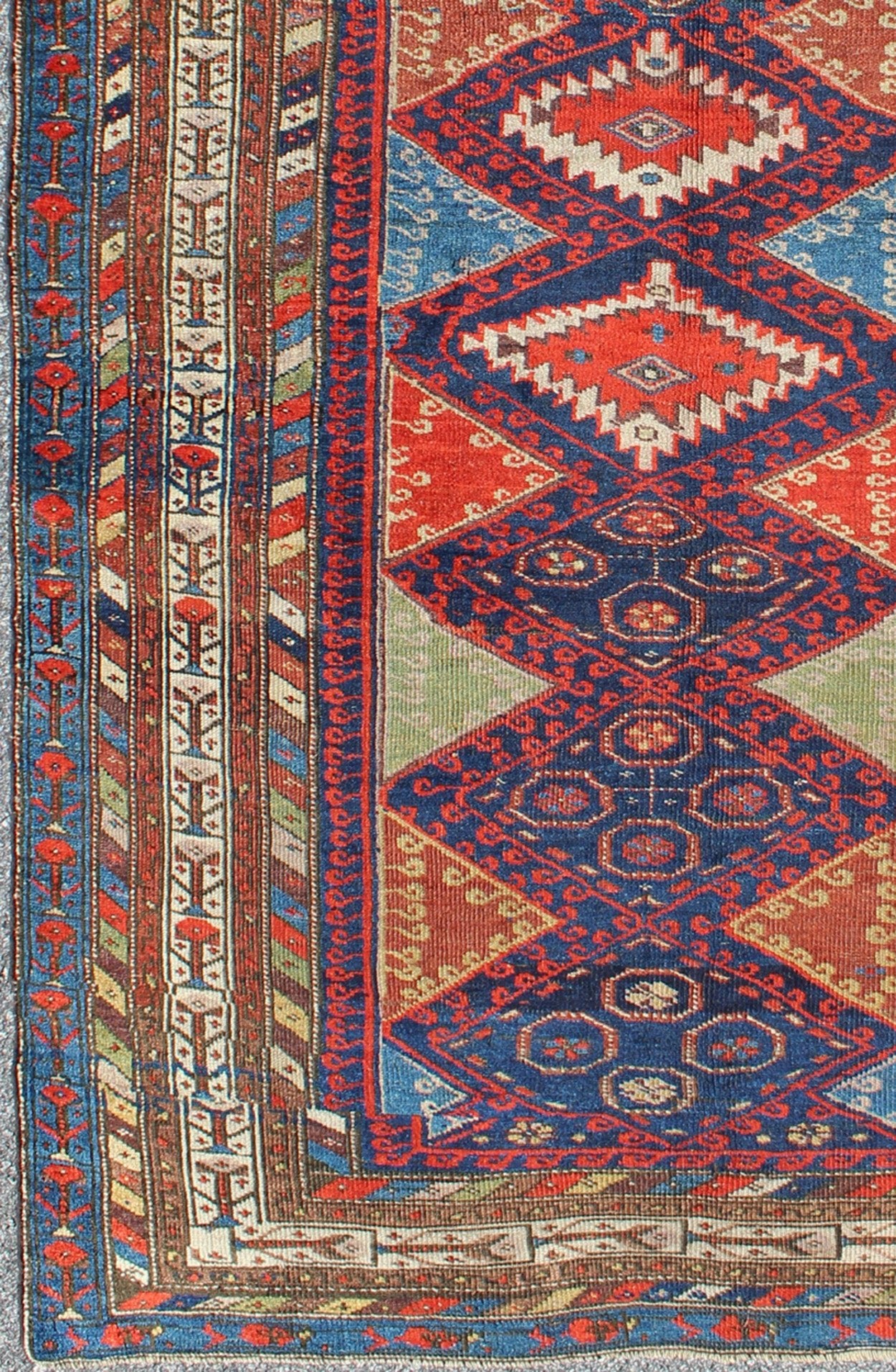 Antique Kurdish Kazak with Tribal and Geometric Motifs KWARUG C - 0525 Regardless of where you place this remarkable carpet, its stunning array of colors and exquisite geometric design will transport you to a place of rare, exotic beauty. Fashione... - Keivan Woven ArtsC - 0525 - 223