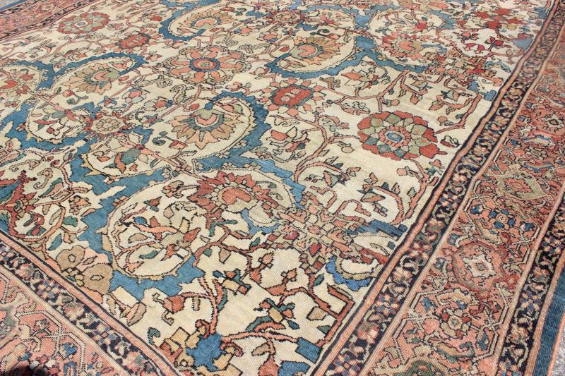 Antique Persian Sultanabad Rug with Ivory Background This exemplary antique Sultanabad rug features a large - scale design comprised of palmettes and stylized flowers. The gorgeous piece is characterized by a rare color combination: An ivory field... - Keivan Woven ArtsD - 0702 - 3011Rug