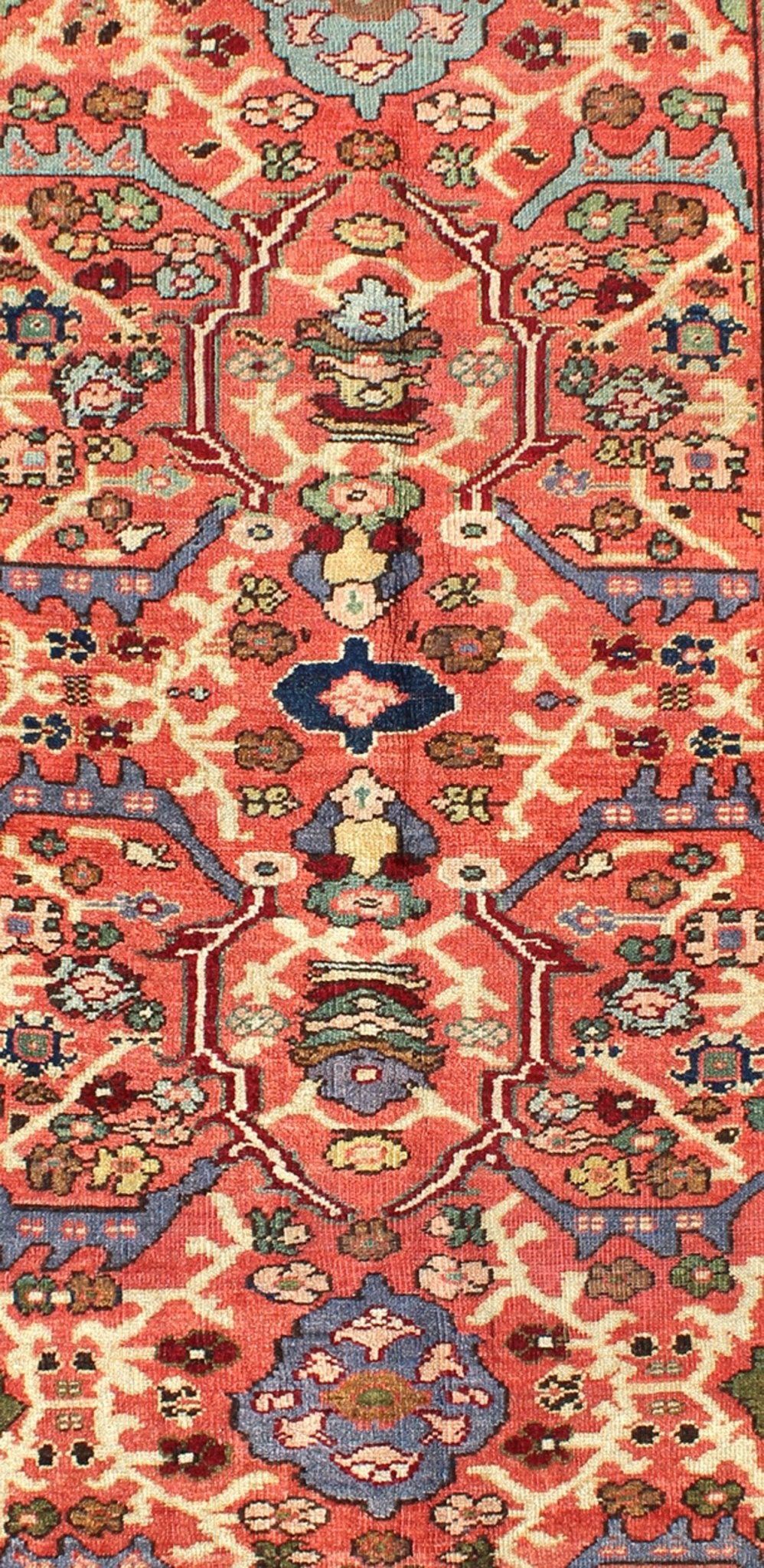 Antique Persian Sultanabad Rug A beautiful Sultanabad rug, this piece features a cinnamon - shaded field bearing an intricate floral motif of repeating red, light purple and pink flowers. A thin blue border displays straight rows of single blossom... - Keivan Woven ArtsD - 0924 - 1847Rug