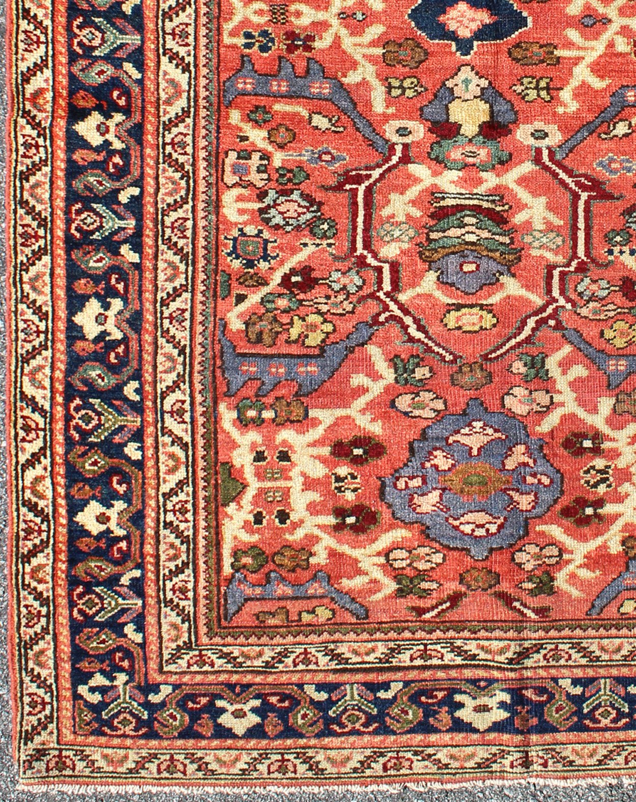 Antique Persian Sultanabad Rug A beautiful Sultanabad rug, this piece features a cinnamon - shaded field bearing an intricate floral motif of repeating red, light purple and pink flowers. A thin blue border displays straight rows of single blossom... - Keivan Woven ArtsD - 0924 - 1847Rug