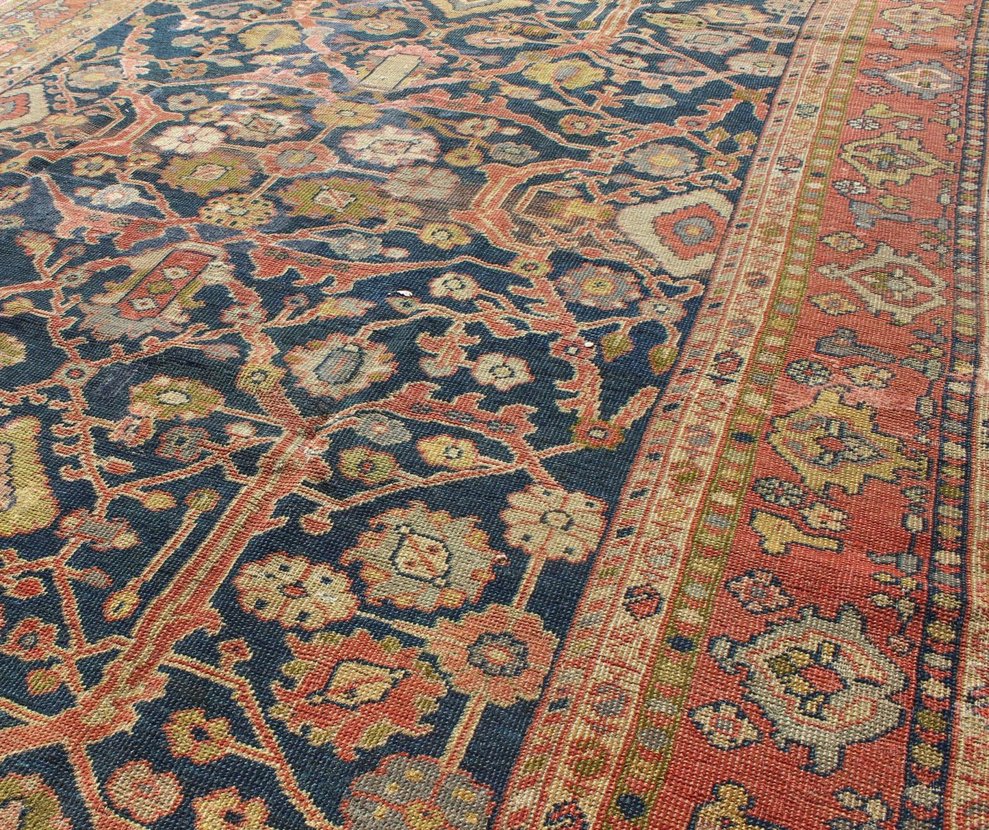 This Antique Sultanabad displays a glorious all over design imbued with a rich palate of colors. Breathtaking flowers of various colors interweave throughout the main field and are surrounded by a warm toned border. - Keivan Woven ArtsE - 0512 - 964Rug