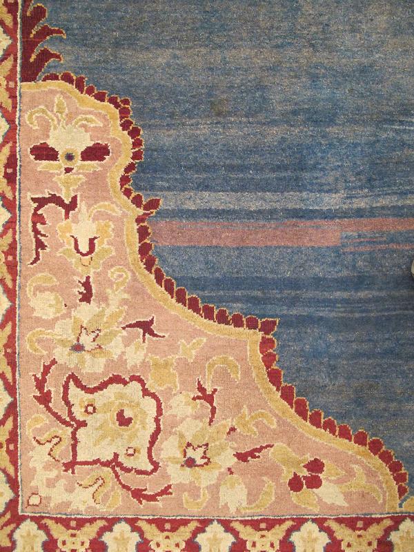 Antique 19th Century Indian Agra Rug in Solid Blue Background This stunning antique Agra carpet beautifully illustrates the magnificent splendor of mid - 19th Century Indian design and craftsmanship. The unusually bold open center field in various... - Keivan Woven ArtsE - 1009 - 677Rug