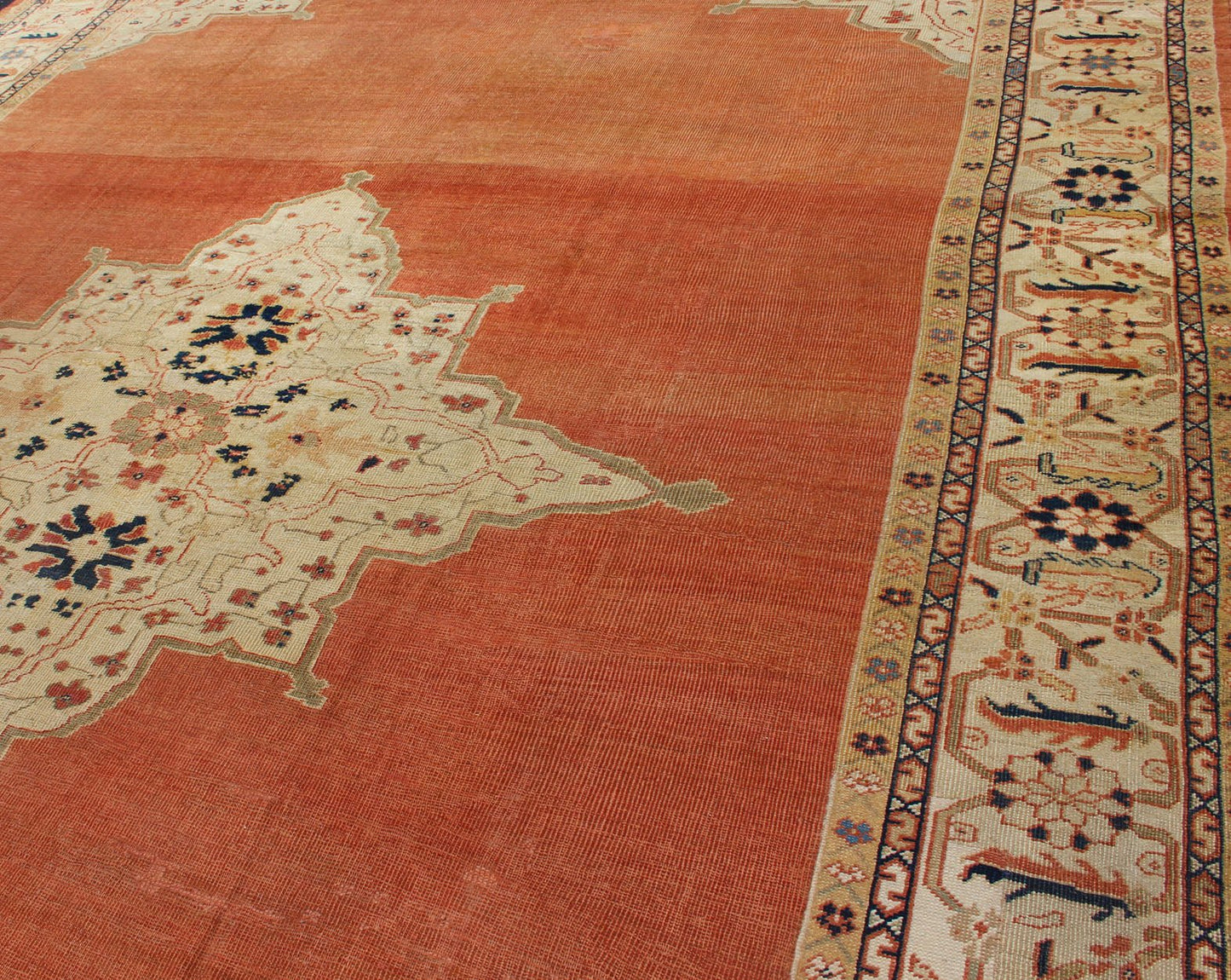 Large Antique Ziegler Sultanabad rug with central medallion in soft orange, ivory and pops of navy blue. Keivan Woven Arts / E - 1207. Late 19th Century Persian Antique Ziegler, antique Persian Ziegler. Measures: 10'2 x 14'5 This striking antique Z... - Keivan Woven ArtsE - 1207 - 1827Rug