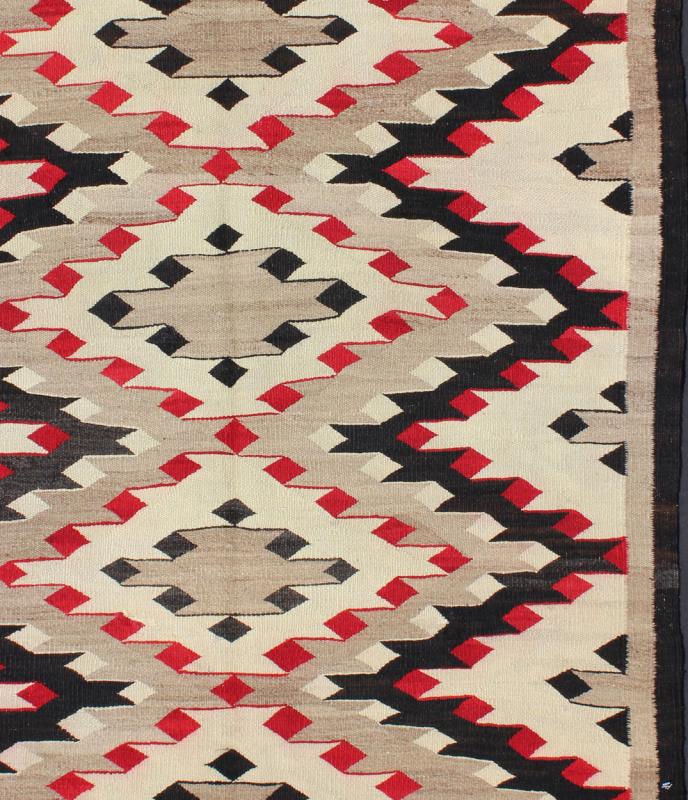 Vintage Navajo Rug with All Over Geometric in Gray, Red, Black and Cream This intriguing vintage Navajo rug was woven in the United States during the first half of the 20th century. The exciting and unique composition boasts a captivating geomet... - Keivan Woven ArtsEBD - 1022 - 6560Rug