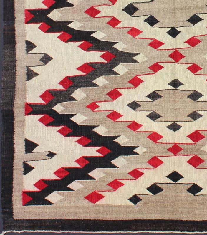 Vintage Navajo Rug with All Over Geometric in Gray, Red, Black and Cream This intriguing vintage Navajo rug was woven in the United States during the first half of the 20th century. The exciting and unique composition boasts a captivating geomet... - Keivan Woven ArtsEBD - 1022 - 6560Rug