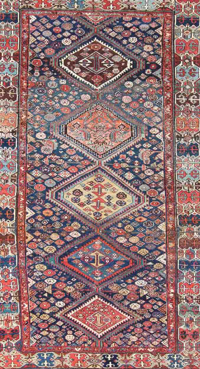 Blue and red antique Persian Hamedan rug with vertical diamond multi - medallions, rug ema - 7563, country of origin / type: Iran / Hamedan, circa 1890. This magnificent antique Hamedan features beautiful coloration, including tones of blue, red, nu... - Keivan Woven ArtsEMA - 7563 - 9820Rug