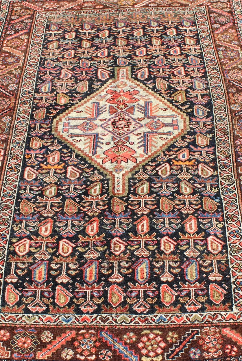 Antique Persian Kurdish Colorful Rug with Medallion and Geometric Motifs kwarugs Geometric antique Kurdish rug from Persia with medallion and all - over design, rug ema - 7570, country of origin / type: Iran / Kurdish, circa 1910. This antiqu... - Keivan Woven ArtsEMA - 7570 - 9842Rug