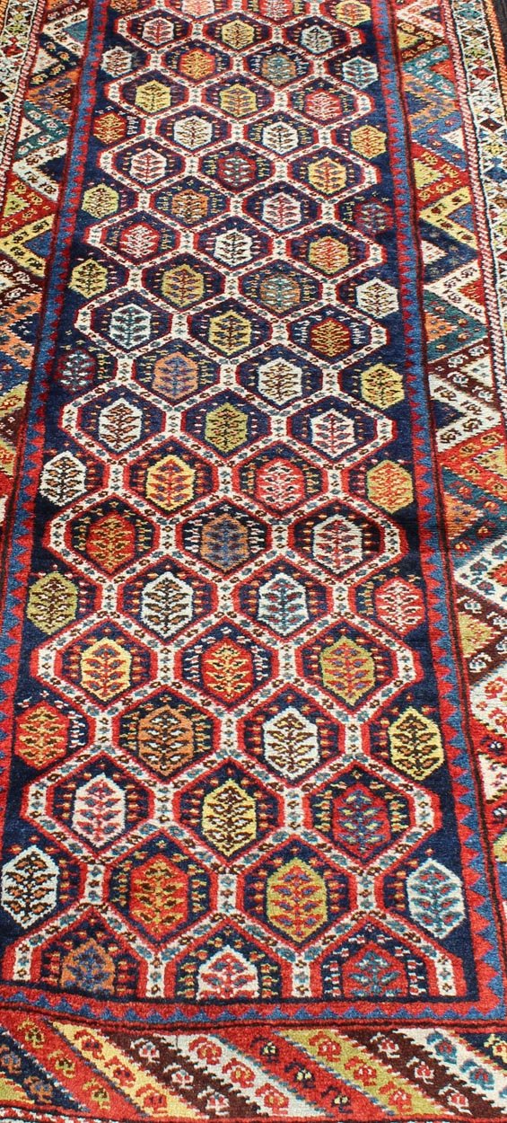 Colorful Antique Persian Lori Runner with Repeating Geometric Palmette Design Lori Antique Persian Runner in Multi - Colors with All - Over Geometric Leaf Design, rug ema - 7576, country of origin / type: Iran / Mahal, circa 1900 This antique P... - Keivan Woven ArtsEMA - 7576 - 9858Rug