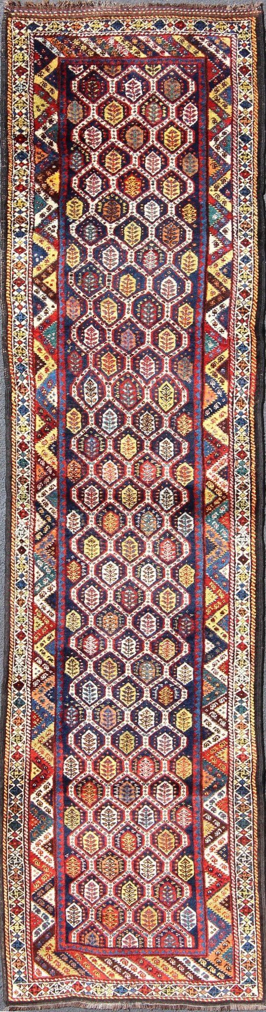 Colorful Antique Persian Lori Runner with Repeating Geometric Palmette Design Lori Antique Persian Runner in Multi - Colors with All - Over Geometric Leaf Design, rug ema - 7576, country of origin / type: Iran / Mahal, circa 1900 This antique P... - Keivan Woven ArtsEMA - 7576 - 9858Rug