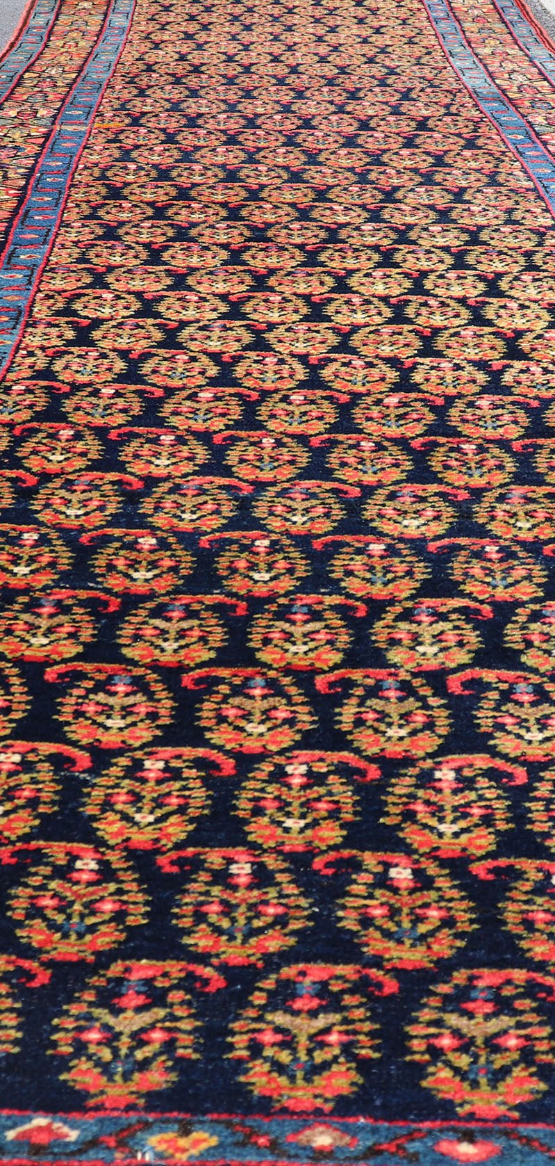 Antique Persian Malayer Paisley Design Runner in Red, Orange, and Blue Measures 3'7 x 18'7 This antique Persian Malayer features a denim blue guard for the small banded border, decorated with modest motifs in varying shades of blue, gree... - Keivan Woven ArtsEMA - 7585 - 10018Rug