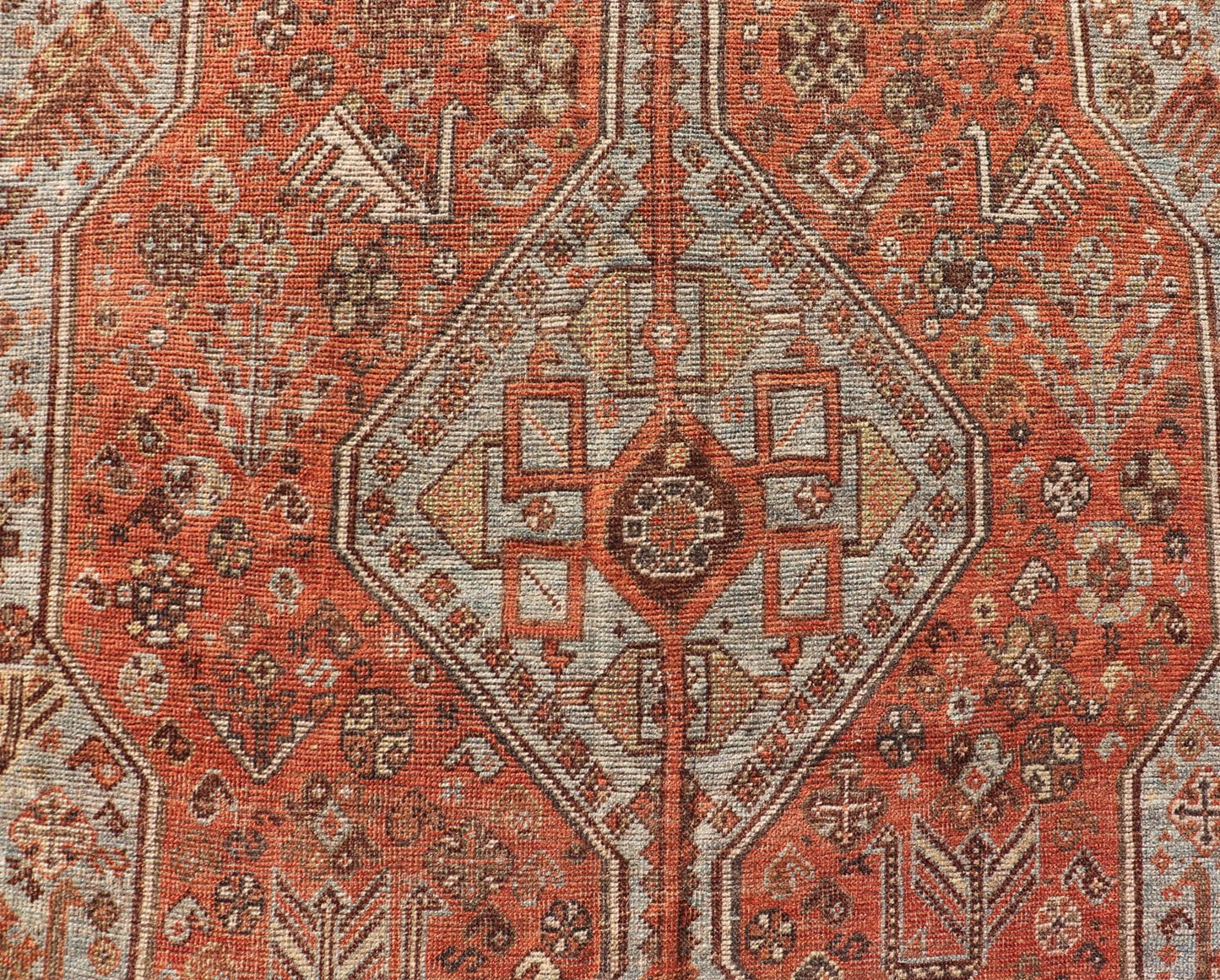 Measures: 7'0 x 10'1 Antique Persian Shiraz Rug With Medallions Geometric in Rusty Orange, Steel Blue. Keivan Woven Arts / rug EMB - 22108 - 15052, country of origin / type: Iran / Shiraz, circa 1920. This antique distressed Persian Shiraz rug (cir... - Keivan Woven ArtsEMB - 22108 - 15052 - 20547Rug