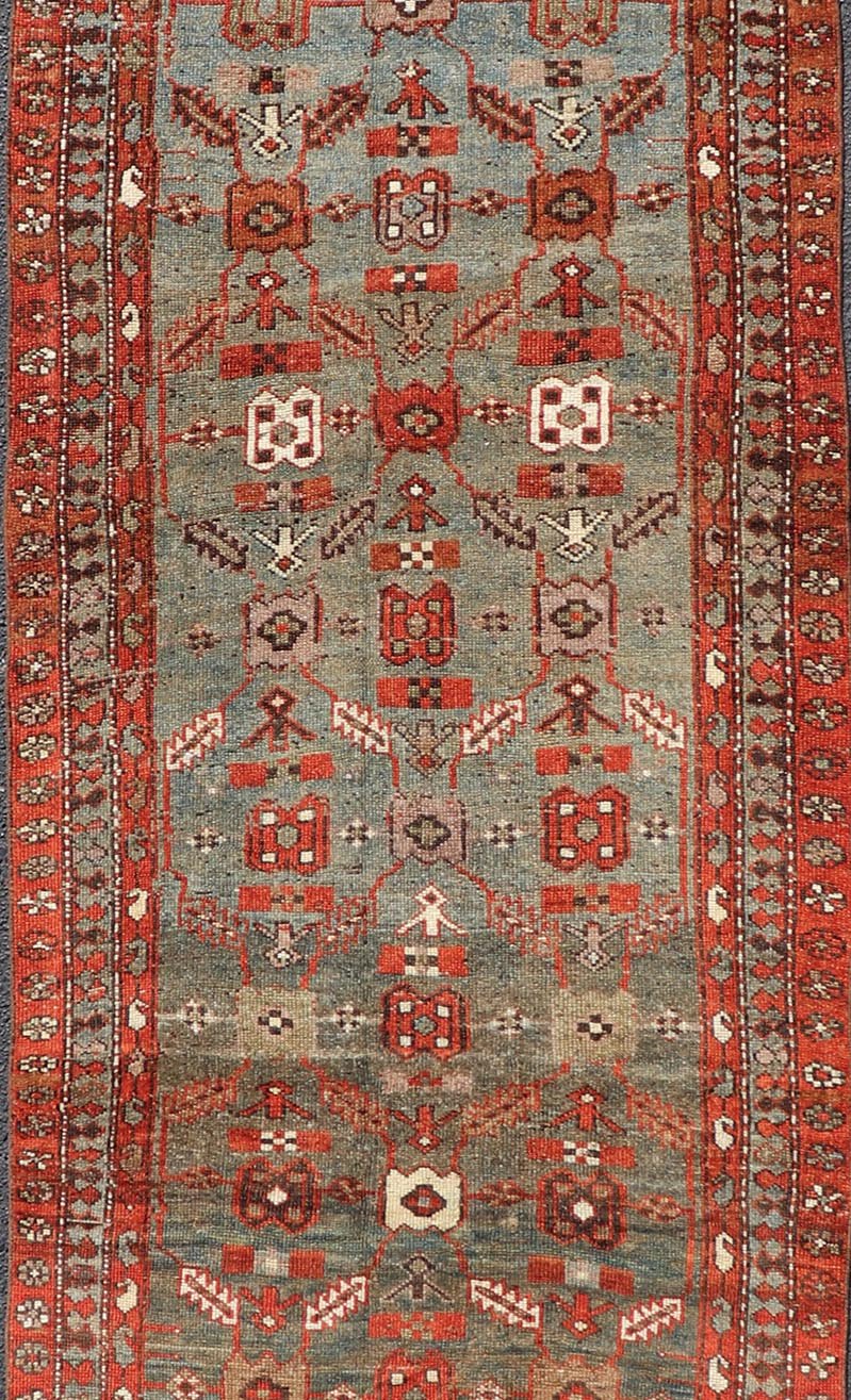 Measures: 3'6 x 13'1 This early 20th century antique Kurdish runner features a all - over tribal motifs with blue, gray, teal, and soft orange red. Kurdish Antique Runner in Vibrant Blue - Teal Background and Multi - Tiered Border. Keivan Woven Arts; rug... - Keivan Woven ArtsEMB - 22131 - 15018 - 20361Rug