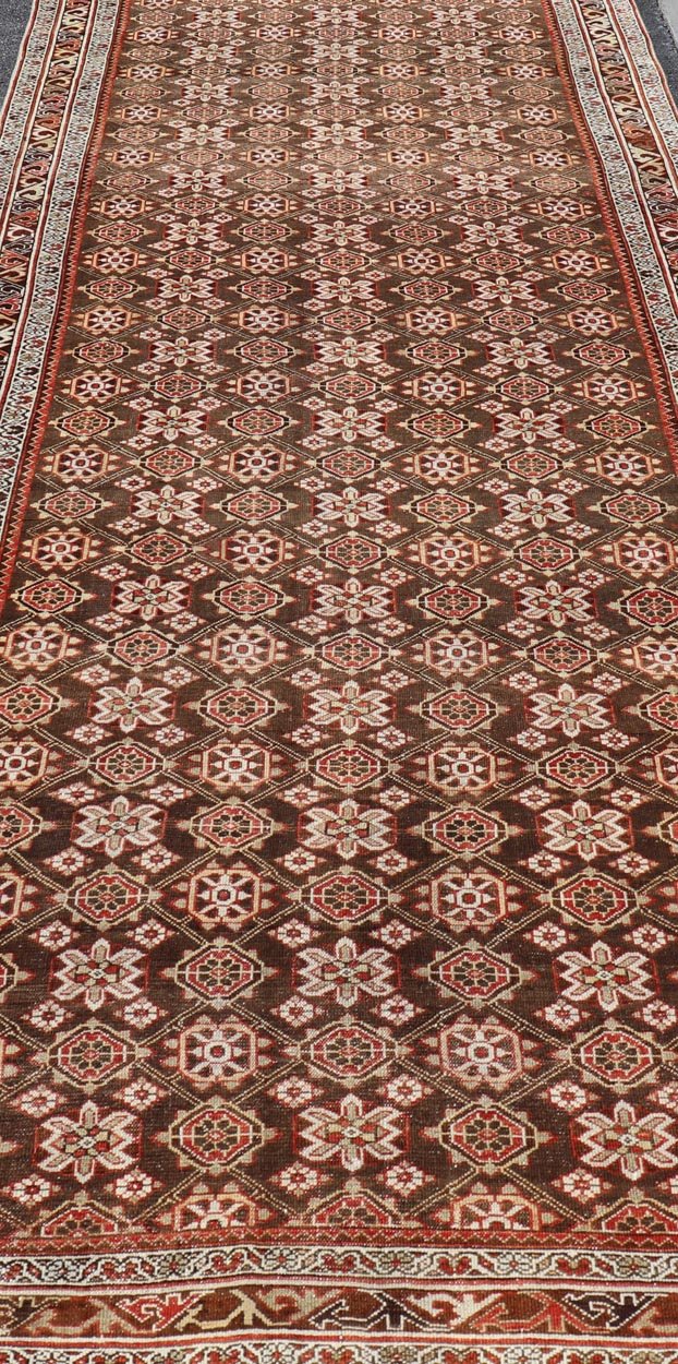 Antique Malayer Persian Gallery Runner with All Over Floral Design. Keivan Woven Arts; rug / EMB - 22226 - 15453 Country of origin: Iran Circa 1920's Type Malayer. Measures: 5'8 x 15'10 This antique Malayer gallery runner features a modest, multi - t... - Keivan Woven ArtsEMB - 22226 - 15453 - 21573