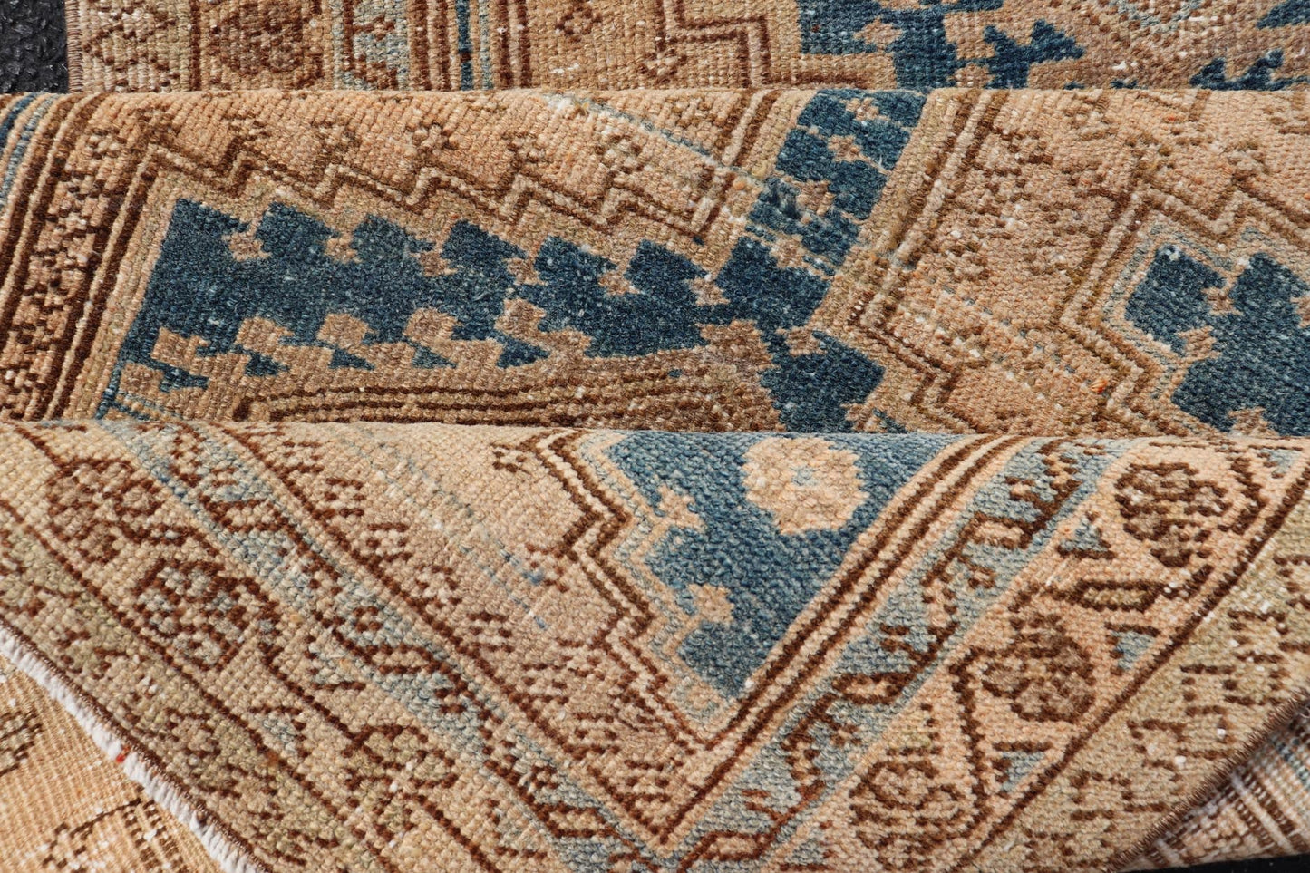 Measures: 3'0 x 10'10 This antique Persian Heriz runner with a distinctive and elegant design. The runner showcases a series of connected geometric medallions running along its length, each intricately detailed with traditional motifs. The central ... - Keivan Woven ArtsEMB - 22240 - 22484Rug