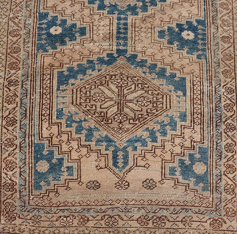 Measures: 3'0 x 10'10 This antique Persian Heriz runner with a distinctive and elegant design. The runner showcases a series of connected geometric medallions running along its length, each intricately detailed with traditional motifs. The central ... - Keivan Woven ArtsEMB - 22240 - 22484Rug