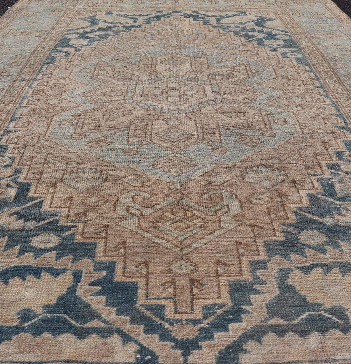 Measures: 4'2 x 6'4 This antique Persian Hamadan rug exemplifies traditional craftsmanship with its bold geometric designs and a harmonious color palette. The rug features a stunning central medallion, highlighted by its intricate detailing and sha... - Keivan Woven ArtsEMB - 22280 - 26190
