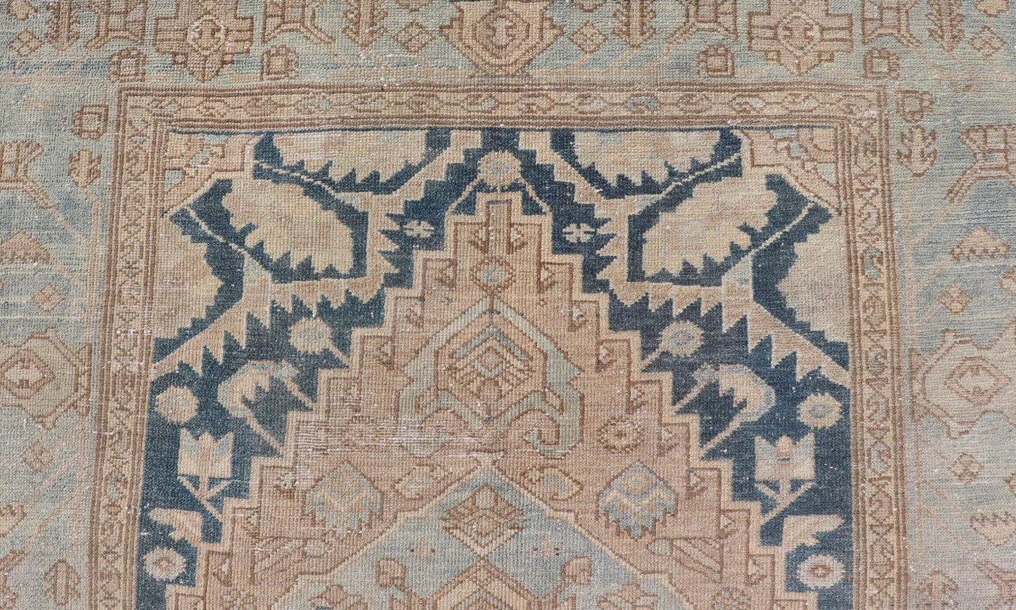Measures: 4'2 x 6'4 This antique Persian Hamadan rug exemplifies traditional craftsmanship with its bold geometric designs and a harmonious color palette. The rug features a stunning central medallion, highlighted by its intricate detailing and sha... - Keivan Woven ArtsEMB - 22280 - 26190