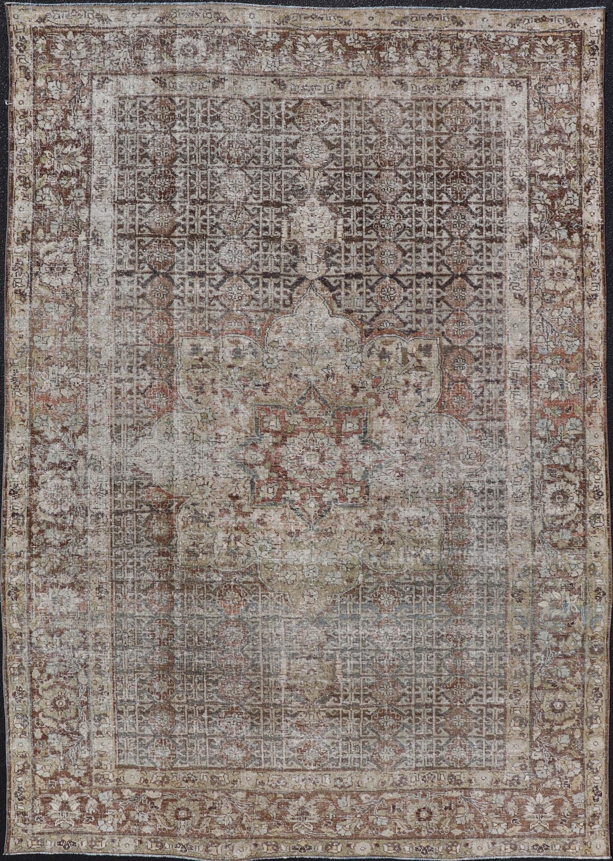 Antique Hand - Knotted Distressed Persian Mahal Rug in Wool with Medallion Design This antique distressed Persian Mahal rug has been hand - knotted in wool and features a large medallion design rendered in muted tones, a complementary, multi - tiered... - Keivan Woven ArtsEMB - 5000 - P13060 - 16406Rug