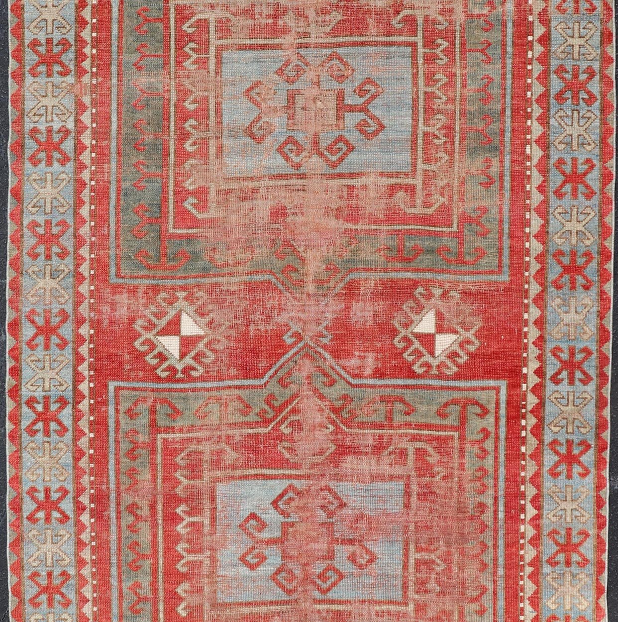 This antique Kazak hand - knotted rug features a geometric double box design and is enclosed within a complementary, multi - tiered border. The rug is rendered in blue, green, cream, red and brown tones; making this rug a perfect fit for a variety of class... - Keivan Woven ArtsEMB - 8552 - 178968 - 13830Rug