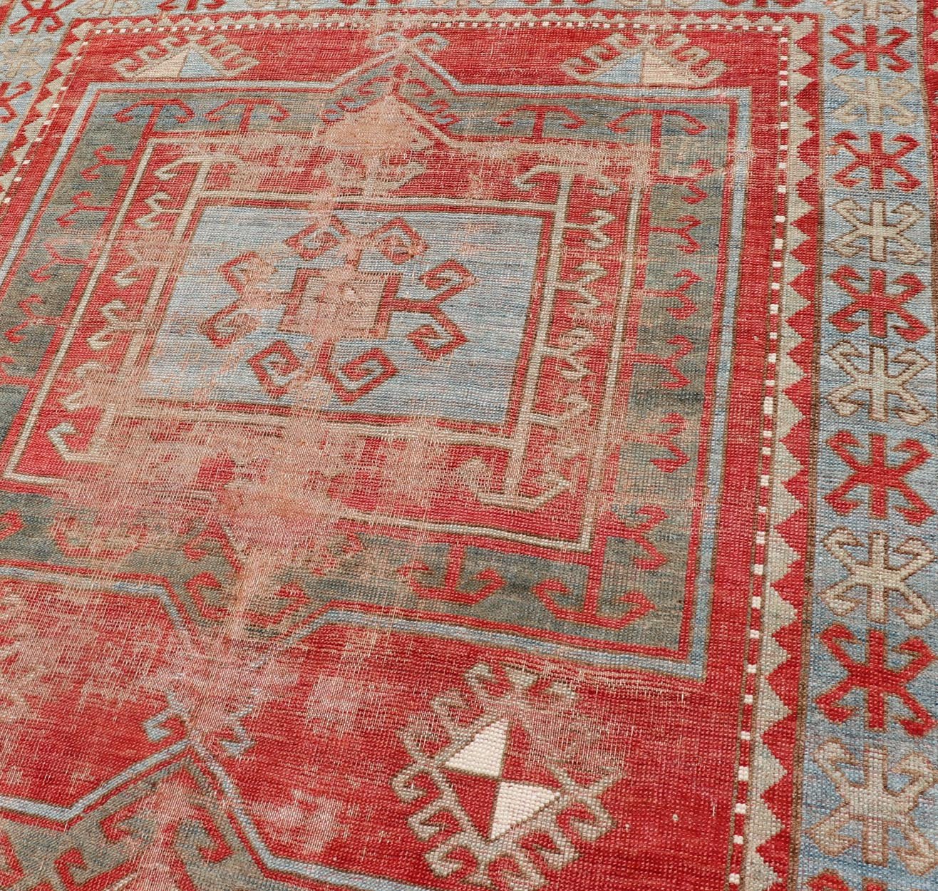 This antique Kazak hand - knotted rug features a geometric double box design and is enclosed within a complementary, multi - tiered border. The rug is rendered in blue, green, cream, red and brown tones; making this rug a perfect fit for a variety of class... - Keivan Woven ArtsEMB - 8552 - 178968 - 13830Rug