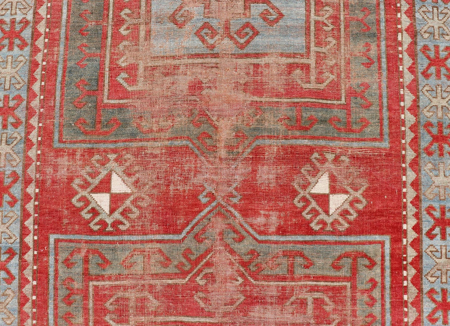 This antique Kazak hand - knotted rug features a geometric double box design and is enclosed within a complementary, multi - tiered border. The rug is rendered in blue, green, cream, red and brown tones; making this rug a perfect fit for a variety of class... - Keivan Woven ArtsEMB - 8552 - 178968 - 13830Rug