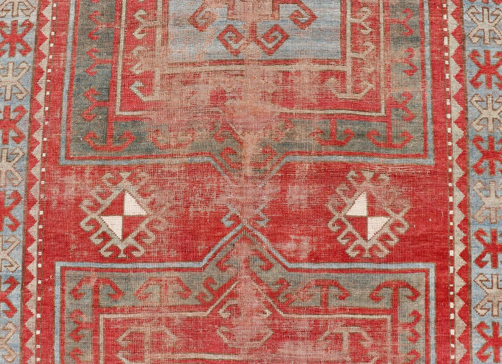 This antique Kazak hand - knotted rug features a geometric double box design and is enclosed within a complementary, multi - tiered border. The rug is rendered in blue, green, cream, red and brown tones; making this rug a perfect fit for a variety of class... - Keivan Woven ArtsEMB - 8552 - 178968 - 13830Rug