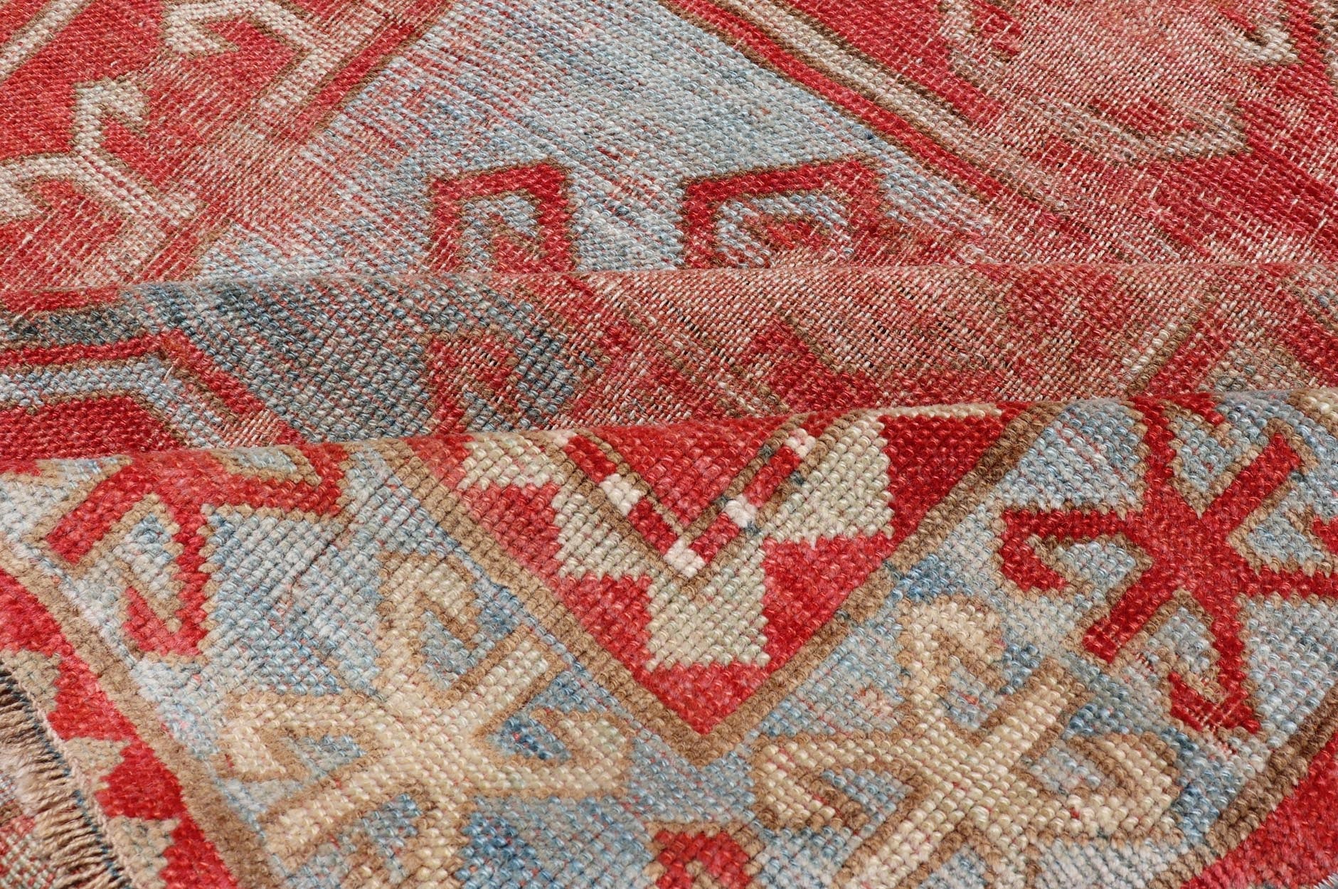This antique Kazak hand - knotted rug features a geometric double box design and is enclosed within a complementary, multi - tiered border. The rug is rendered in blue, green, cream, red and brown tones; making this rug a perfect fit for a variety of class... - Keivan Woven ArtsEMB - 8552 - 178968 - 13830Rug