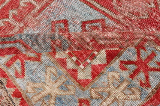 This antique Kazak hand - knotted rug features a geometric double box design and is enclosed within a complementary, multi - tiered border. The rug is rendered in blue, green, cream, red and brown tones; making this rug a perfect fit for a variety of class... - Keivan Woven ArtsEMB - 8552 - 178968 - 13830Rug