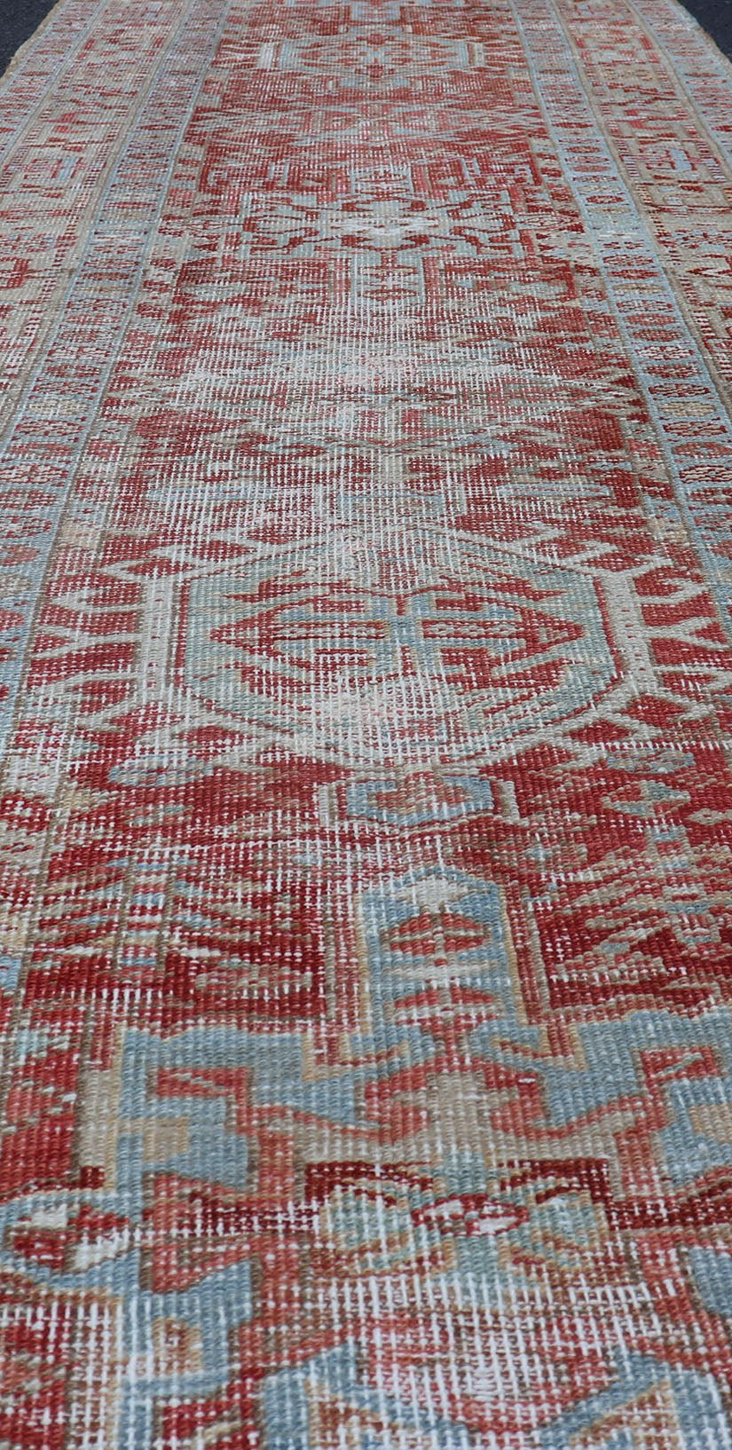Antique Persian Heriz Distressed Runner with Geometrics in Red and Light Blue. Geometric Medallion design Persian distressed Heriz antique runner in soft red and blue tones, rug EMB - 9531 - 10 - P13034, country of origin / type: Iran / Heriz, circa 1... - Keivan Woven ArtsEMB - 9531 - 10 - P13034 - 14704Rug