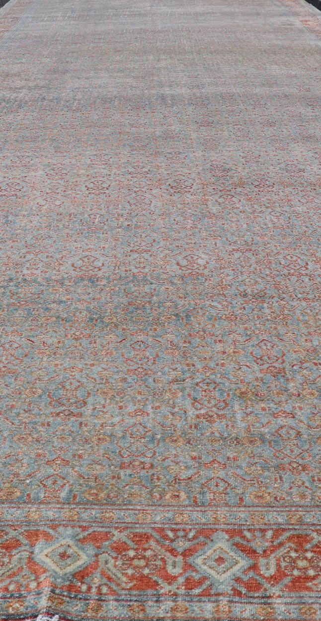 Hand - Knotted Antique Persian Long Gallery Senneh in Wool with All - Over Design This antique Persian long gallery Senneh rug has been hand - knotted in wool. The rug features an all - over sub - geometric design, set upon a blue background. The rug has ... - Keivan Woven ArtsEMB - 9582 - P13876 - 15158Rug