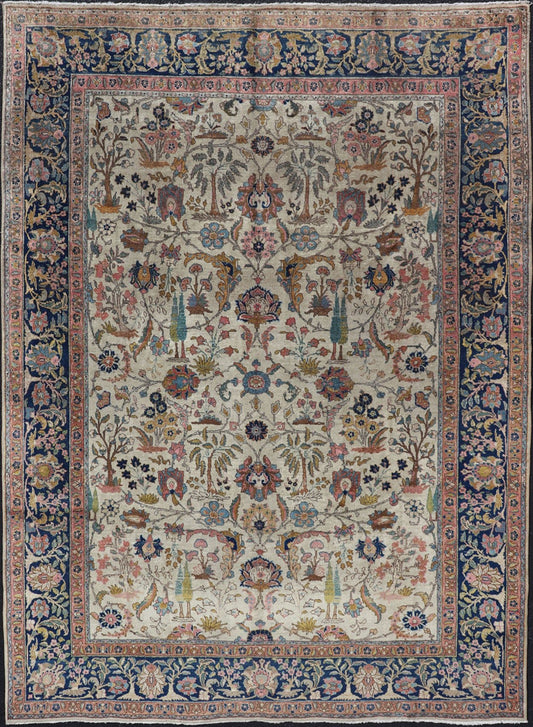 Antique Tabriz with All - Over Floral Sub - Geometric Design & Complementary Border This stunning Antique Tabriz rug (circa 1920s) features a lovely all - over floral design rendered in gold, coral, shades of blue, and pink set upon an Ivory backgroun... - Keivan Woven ArtsEMB - 9593 - P13518 - 15607Rug
