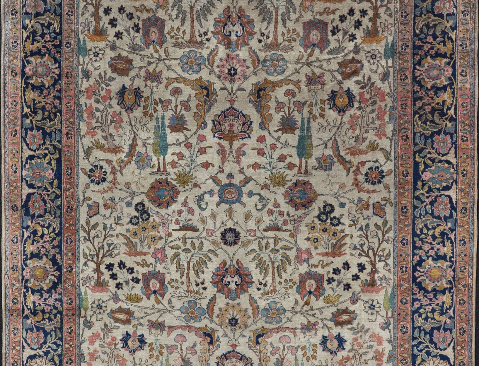 Antique Tabriz with All - Over Floral Sub - Geometric Design & Complementary Border This stunning Antique Tabriz rug (circa 1920s) features a lovely all - over floral design rendered in gold, coral, shades of blue, and pink set upon an Ivory backgroun... - Keivan Woven ArtsEMB - 9593 - P13518 - 15607Rug