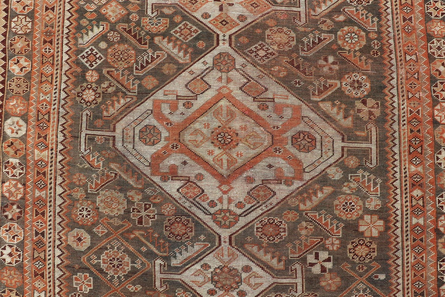 Antique Hand - Knotted Persian Shiraz in Wool with All - Over Medallion Design This antique Persian Shiraz rug has been hand - knotted in wool and features an all - over sub - geometric design rendered in multicolor. A complementary, multi - tiered border ... - Keivan Woven ArtsEMB - 9606 - P13865 - 15649Rug