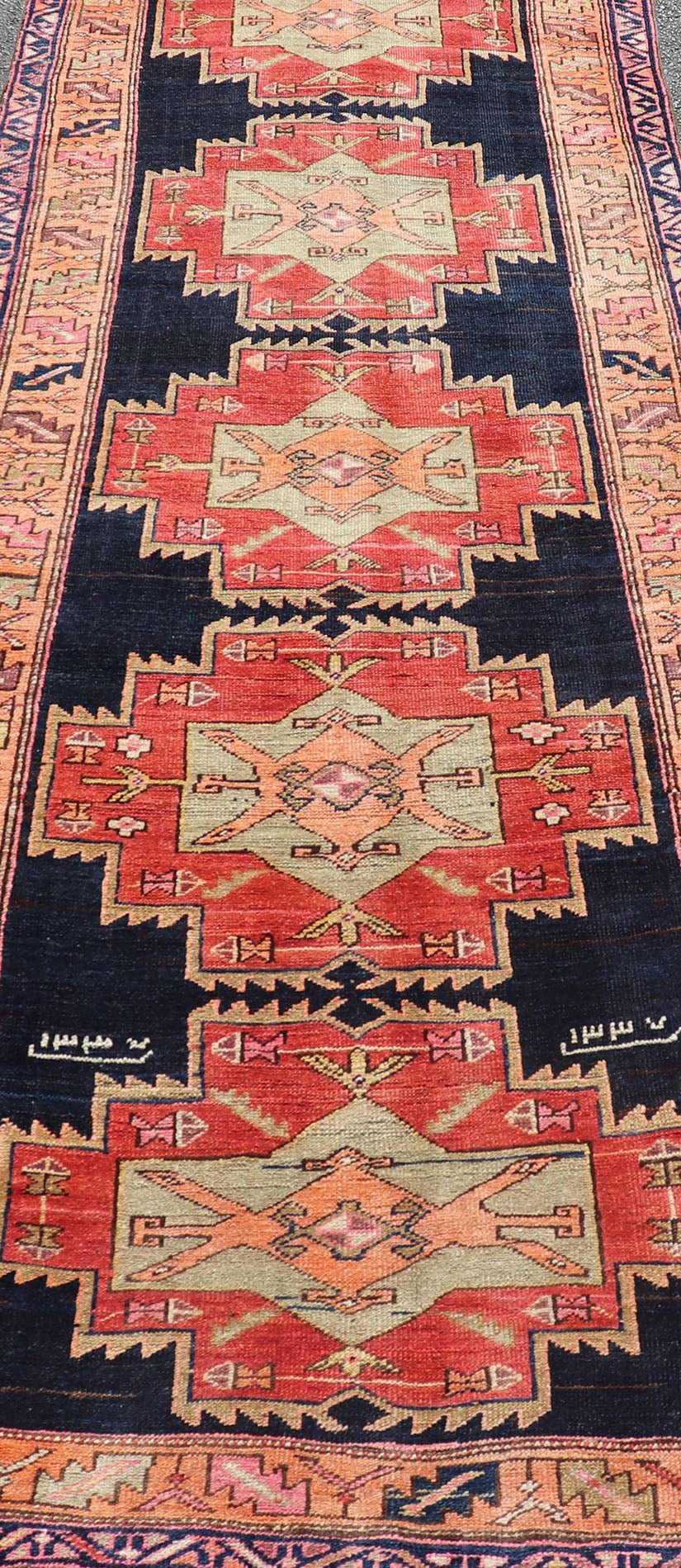 Long Hand - Knotted Antique Persian Azerbaijan Runner in Wool with Medallions This antique Persian Azerbaijan styled runner has been hand - knotted in wool. The rug features a sub - geometric medallion design, and is enclosed within a complementary, ... - Keivan Woven ArtsEMB - 9608 - P13508 - 15661Rug