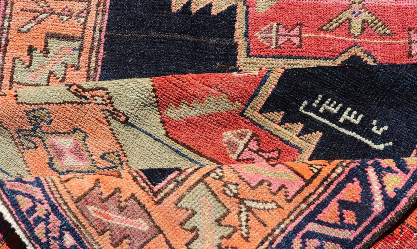 Long Hand - Knotted Antique Persian Azerbaijan Runner in Wool with Medallions This antique Persian Azerbaijan styled runner has been hand - knotted in wool. The rug features a sub - geometric medallion design, and is enclosed within a complementary, ... - Keivan Woven ArtsEMB - 9608 - P13508 - 15661Rug