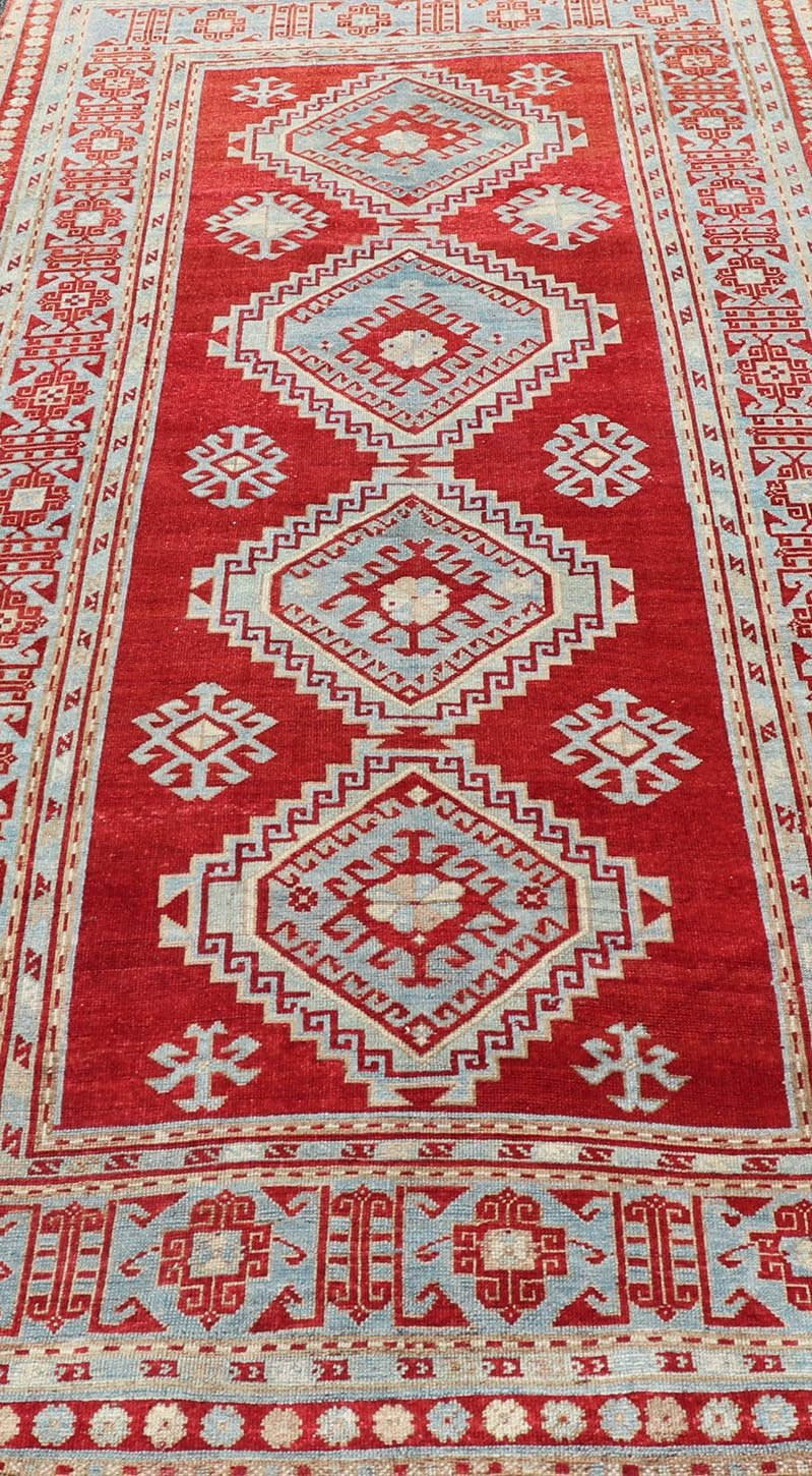 Antique Caucasian Kazak Gallery Rug in Brilliant Red with Geometric Design Tribal geometric medallion design Kazak antique rug, antique Caucasian from Caucasus Region with a beautiful red background in multi - colors, Keivan Woven Arts / rug E... - Keivan Woven ArtsEMB - 9637 - P13567 - 16037Rug