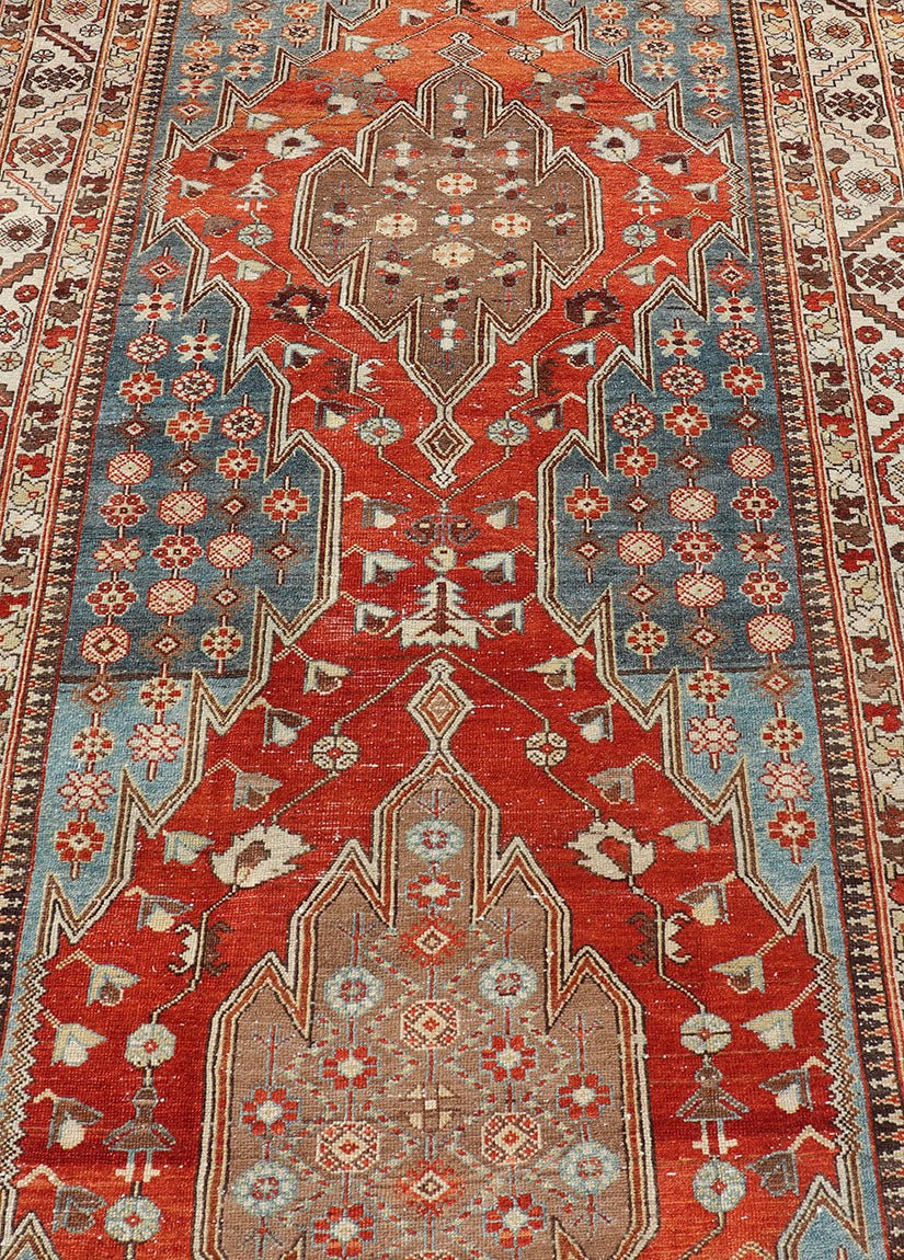 Antique Hamadan Gallery Rug with Geometric Medallions in Red, Blue and Brown This unique Persian Hamadan Gallery rug features an exquisite design composed of a vertical arrangement of red and brown geometric medallions surrounded by a variety of... - Keivan Woven ArtsEMB - 9639 - P13857 - 16043Rug