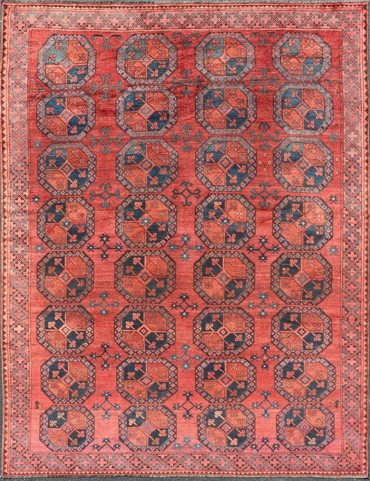 Hand - Knotted Turkomen Ersari Rug in Wool with Gul Design in Red, Orange and Blue This Turkomen Ersari rug has been hand - knotted in the finest wool. The rug features a repeating Gul design throughout the entirety of the rug, enclosed within a co... - Keivan Woven ArtsEMB - 9644 - P13547 - 16073Rug