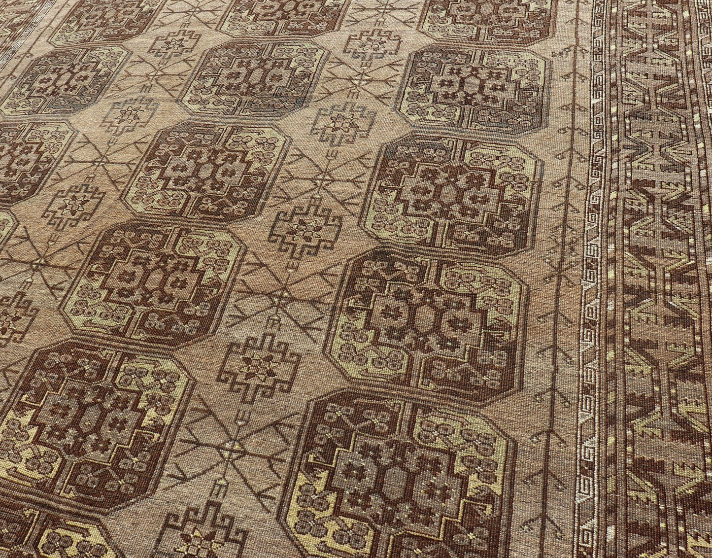 Hand - Knotted Turkomen Ersari Rug in Wool with Repeating Sub - Geometric Gul Design This Turkomen Ersari rug has been hand - knotted in the finest wool. The rug features a repeating Gul design throughout the entirety of the rug, enclosed within a co... - Keivan Woven ArtsEMB - 9649 - P13543 - 16103Rug