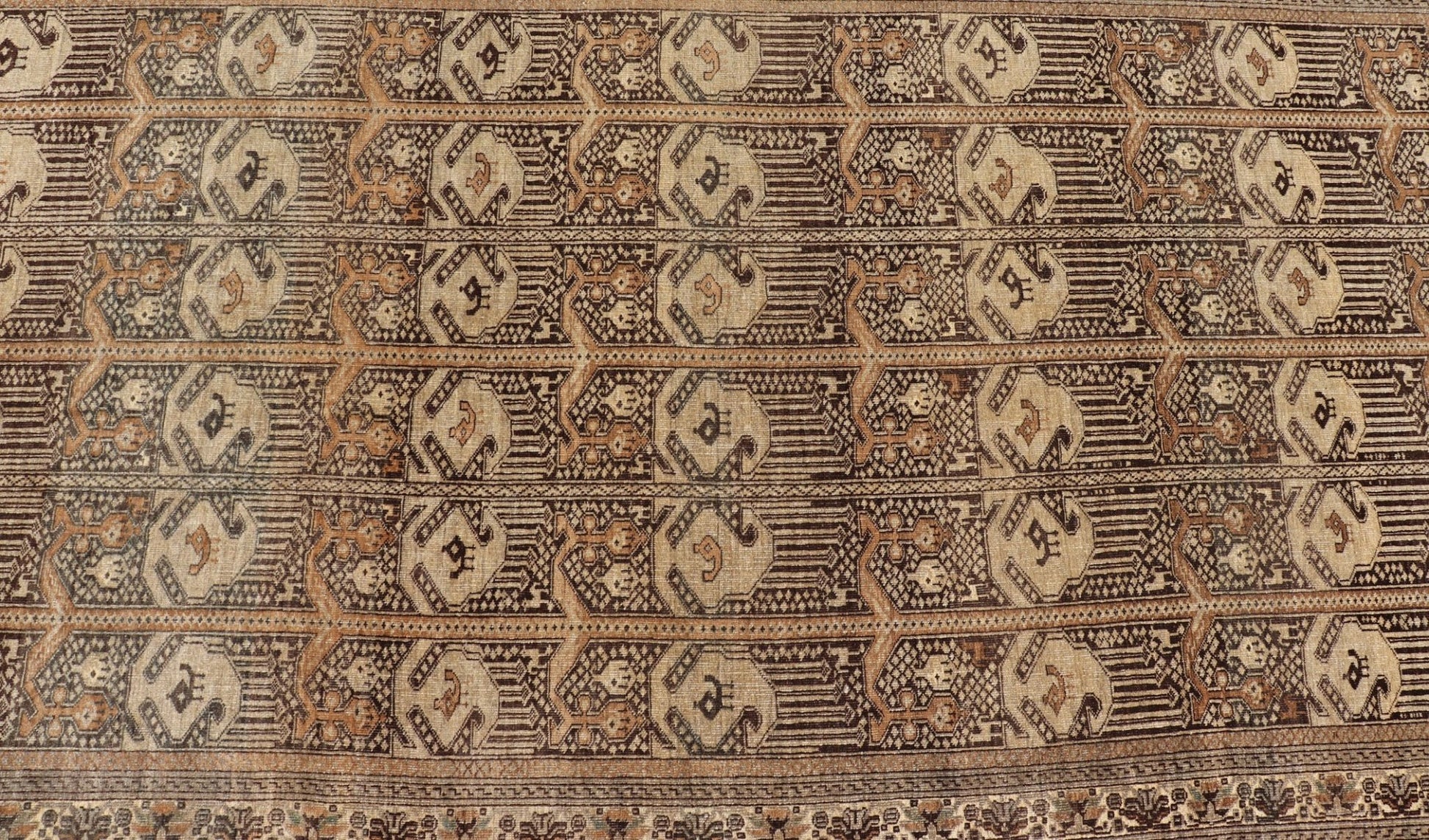 Hand - Knotted Turkomen Ersari Rug in Wool with All - Over Tribal Beluch Design This Ersari rug has been hand - knotted in the finest wool. The rug features a repeating derivative of a tribal beluch design throughout the entirety of the rug, enclose... - Keivan Woven ArtsEMB - 9655 - P13594 - 16133Rug