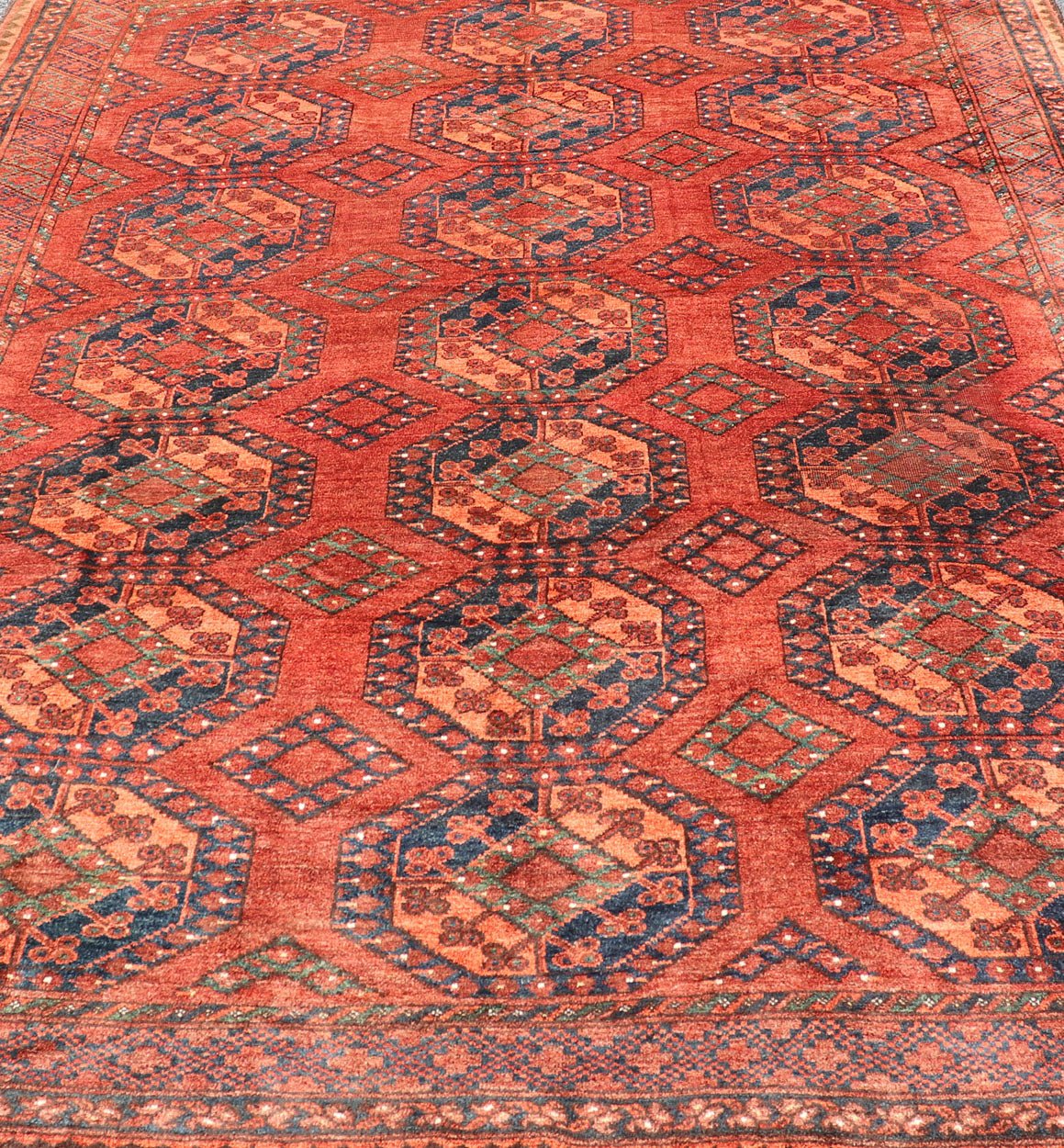 Early 20th Century Hand - Knotted Turkomen Ersari Rug in Wool with Gul Design This Ersari rug has been hand - knotted in the finest wool. The rug features a repeating Gul design throughout the entirety of the piece, enclosed within a complementary,... - Keivan Woven ArtsEMB - 9657 - P13540 - 16145Rug
