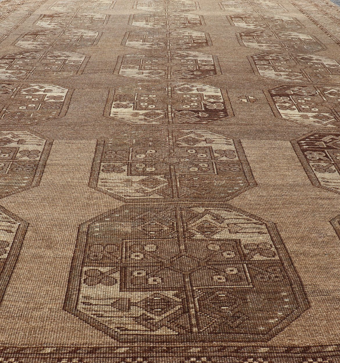Hand - Knotted Turkomen Ersari Rug in Wool with Sub - Geometric Repeating Gul Design This Ersari rug has been hand - knotted in the finest wool. The rug features a sub - geometric repeating Gul design throughout the entirety of the rug, enclosed within... - Keivan Woven ArtsEMB - 9658 - P13539 - 16151Rug