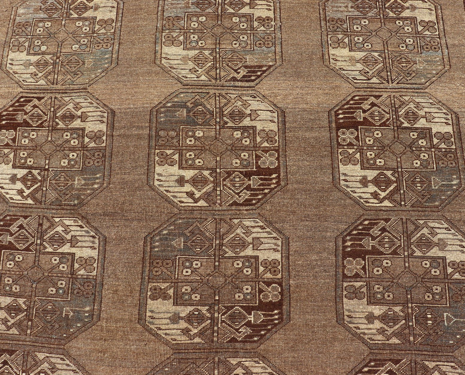 Hand - Knotted Turkomen Ersari Rug in Wool with Sub - Geometric Repeating Gul Design This Ersari rug has been hand - knotted in the finest wool. The rug features a sub - geometric repeating Gul design throughout the entirety of the rug, enclosed within... - Keivan Woven ArtsEMB - 9658 - P13539 - 16151Rug