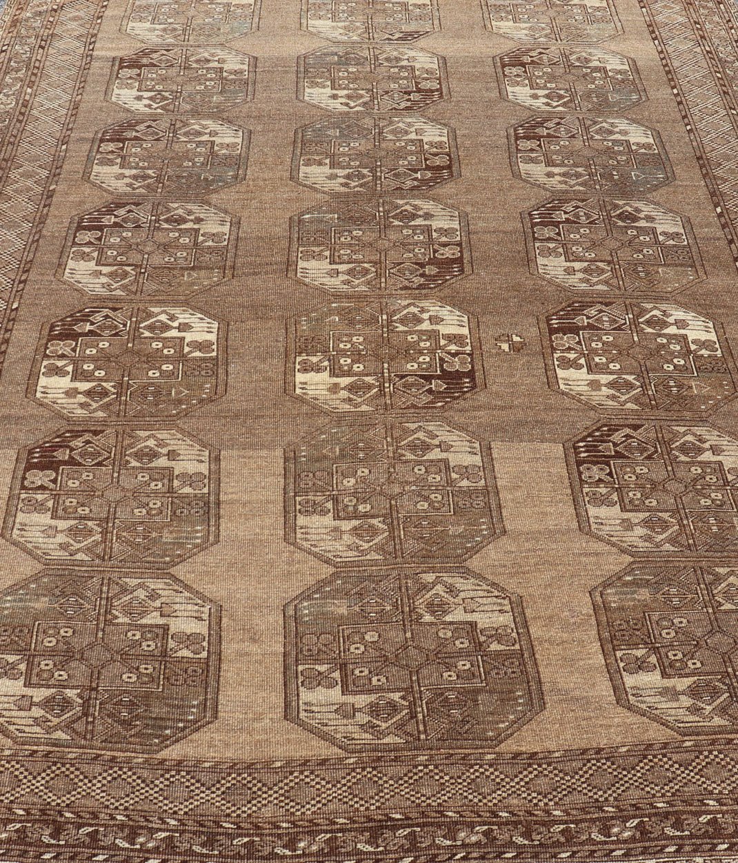 Hand - Knotted Turkomen Ersari Rug in Wool with Sub - Geometric Repeating Gul Design This Ersari rug has been hand - knotted in the finest wool. The rug features a sub - geometric repeating Gul design throughout the entirety of the rug, enclosed within... - Keivan Woven ArtsEMB - 9658 - P13539 - 16151Rug