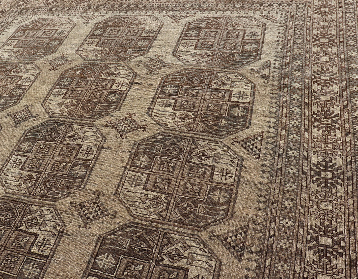 Hand - Knotted Turkomen Ersari Rug in Wool with All - Over Repeating Gul Design This Ersari rug has been hand - knotted in the finest wool. The rug features an all - over repeating Gul design throughout the entirety of the rug, enclosed within a comple... - Keivan Woven ArtsEMB - 9659 - P13591 - 16157Rug