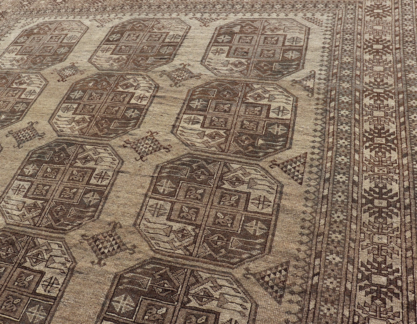 Hand - Knotted Turkomen Ersari Rug in Wool with All - Over Repeating Gul Design This Ersari rug has been hand - knotted in the finest wool. The rug features an all - over repeating Gul design throughout the entirety of the rug, enclosed within a comple... - Keivan Woven ArtsEMB - 9659 - P13591 - 16157Rug