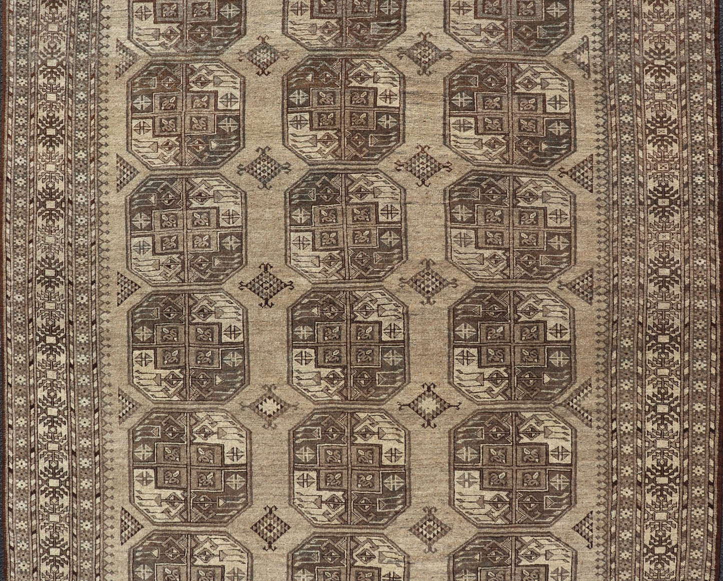 Hand - Knotted Turkomen Ersari Rug in Wool with All - Over Repeating Gul Design This Ersari rug has been hand - knotted in the finest wool. The rug features an all - over repeating Gul design throughout the entirety of the rug, enclosed within a comple... - Keivan Woven ArtsEMB - 9659 - P13591 - 16157Rug