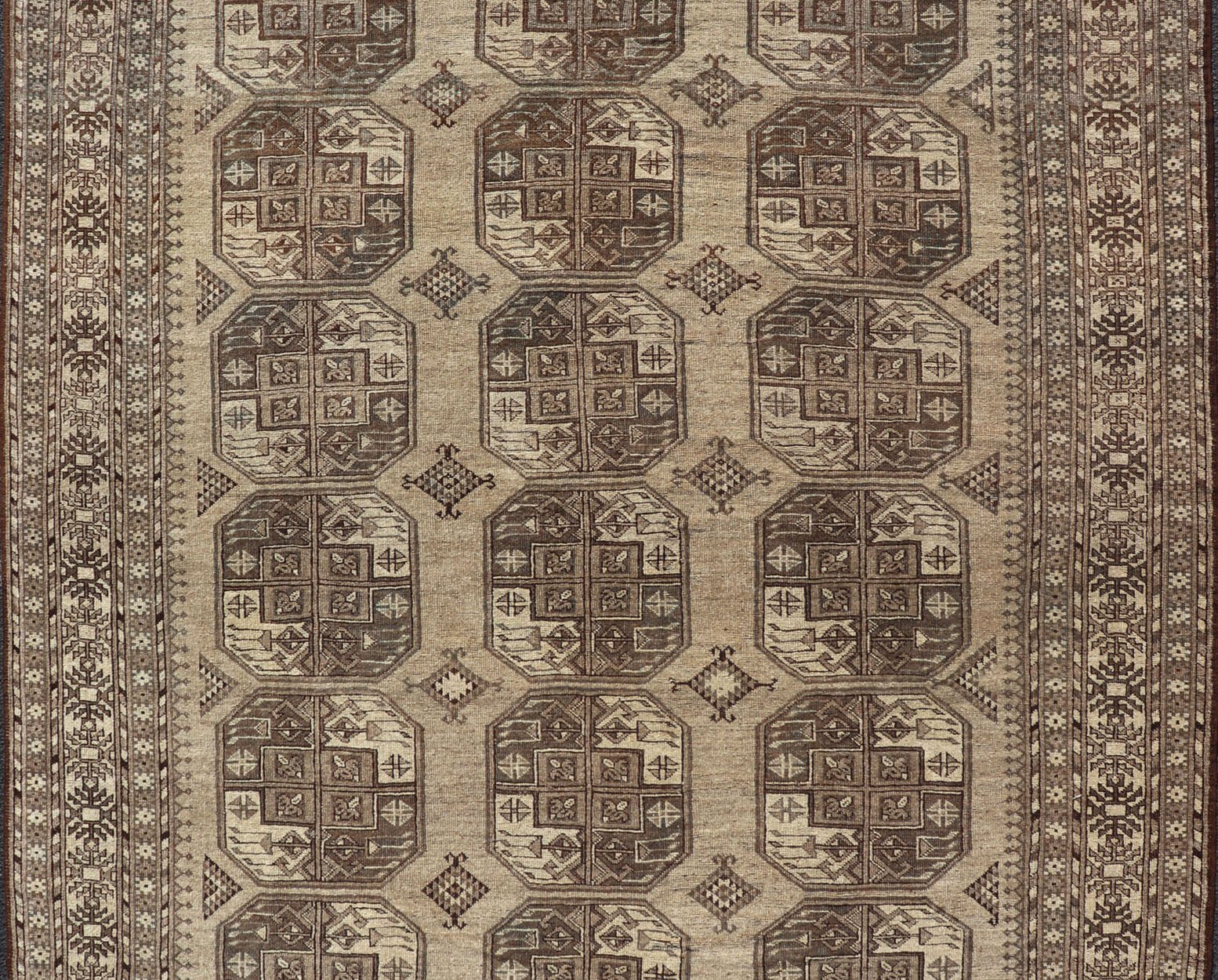 Hand - Knotted Turkomen Ersari Rug in Wool with All - Over Repeating Gul Design This Ersari rug has been hand - knotted in the finest wool. The rug features an all - over repeating Gul design throughout the entirety of the rug, enclosed within a comple... - Keivan Woven ArtsEMB - 9659 - P13591 - 16157Rug