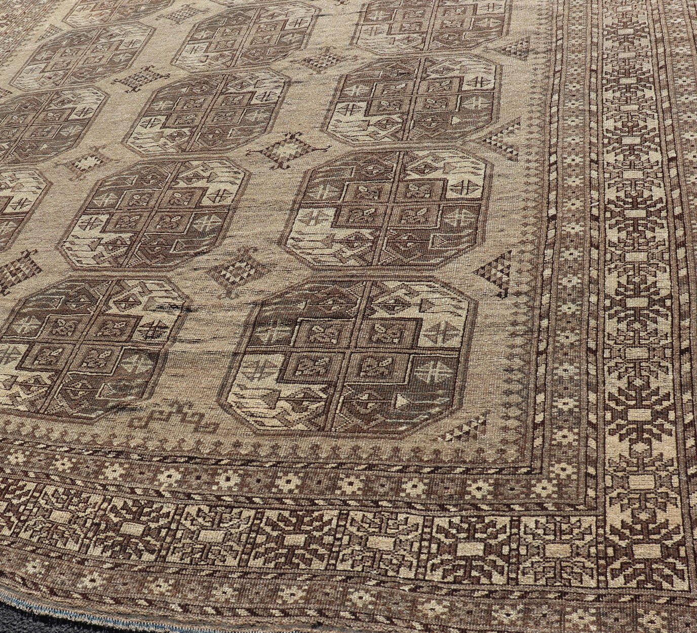 Hand - Knotted Turkomen Ersari Rug in Wool with All - Over Repeating Gul Design This Ersari rug has been hand - knotted in the finest wool. The rug features an all - over repeating Gul design throughout the entirety of the rug, enclosed within a comple... - Keivan Woven ArtsEMB - 9659 - P13591 - 16157Rug